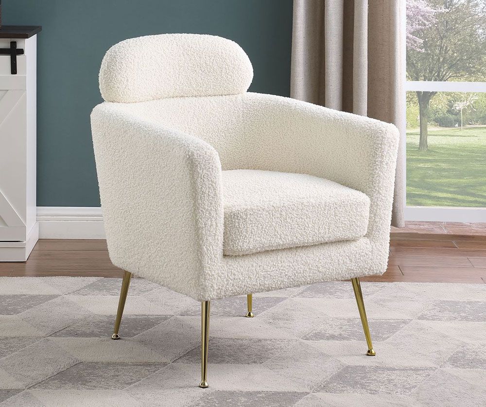 white boucle fabric upholstered accent chair with gold legs